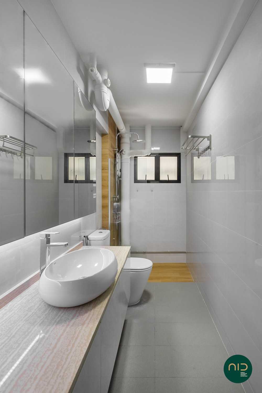 Modern Bathroom with Homogeneous Tiles and Mirror