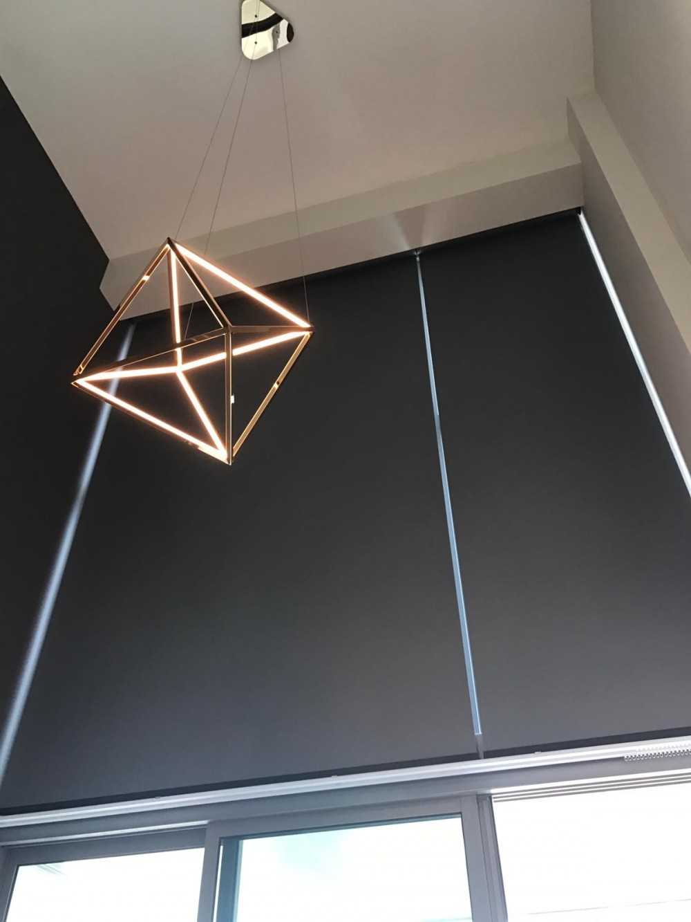 Modern Bedroom with Drop Light and Paintings