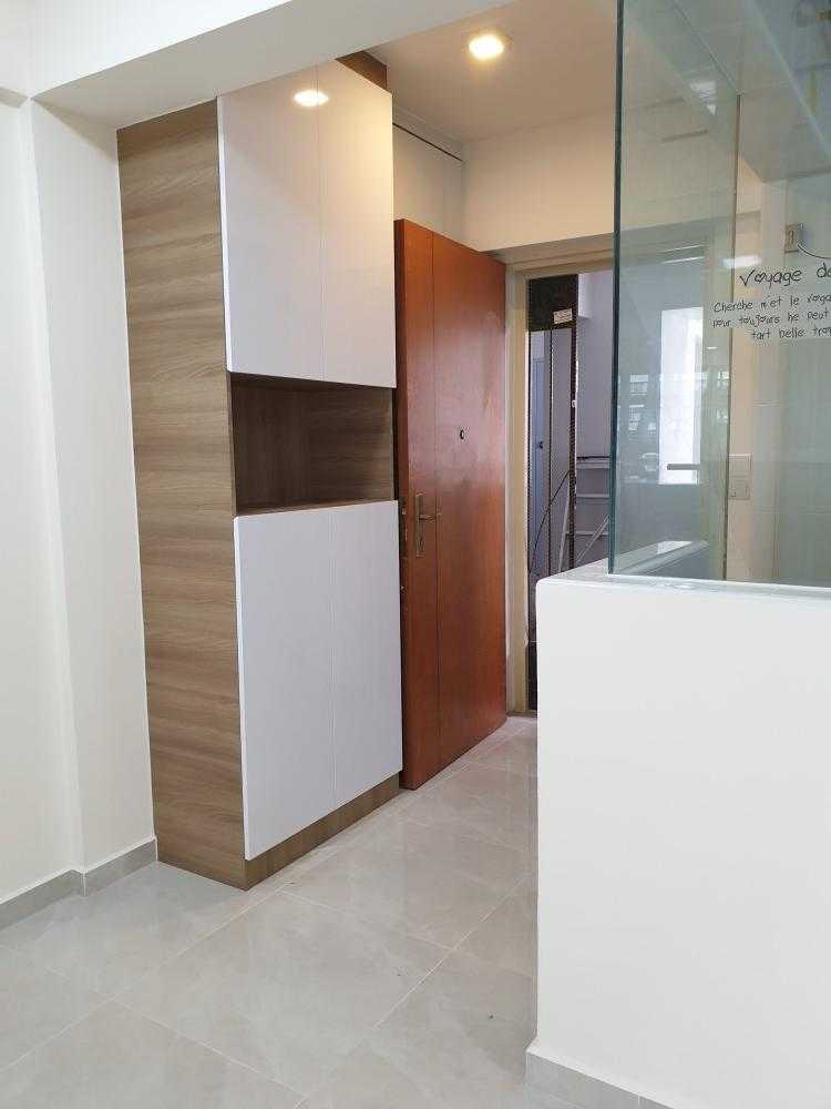 Contemporary Foyer with Homogeneous Tiles and Shoe Cabinets