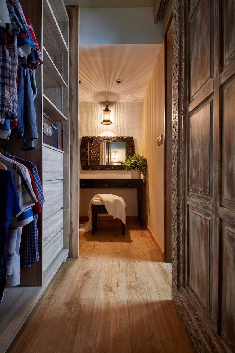 Country Walk-in Wardrobe with Wood Flooring and Drop Light
