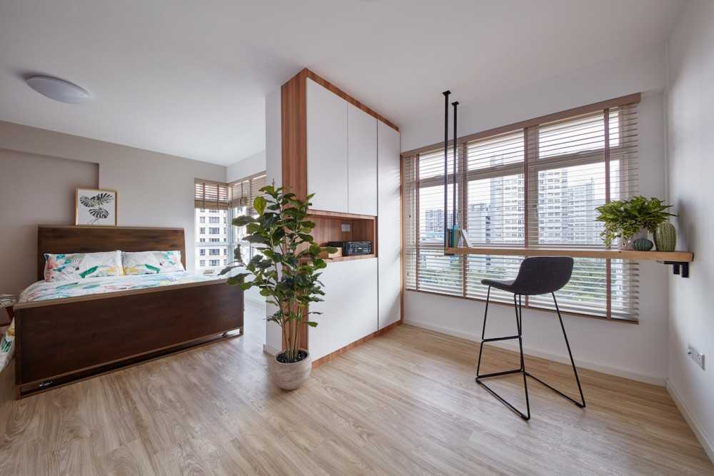 Scandinavian Bedroom with Wood Flooring and Storage Cabinets