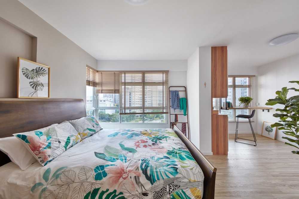 Scandinavian Bedroom with Wood Flooring and Paintings