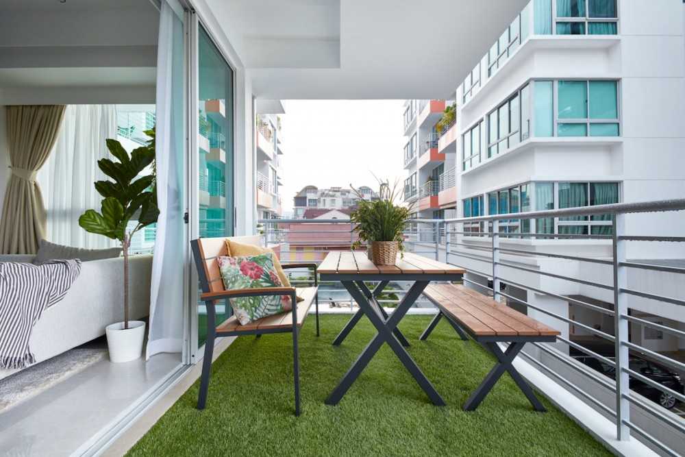 Contemporary Balcony with Outdoor Chairs and Planters