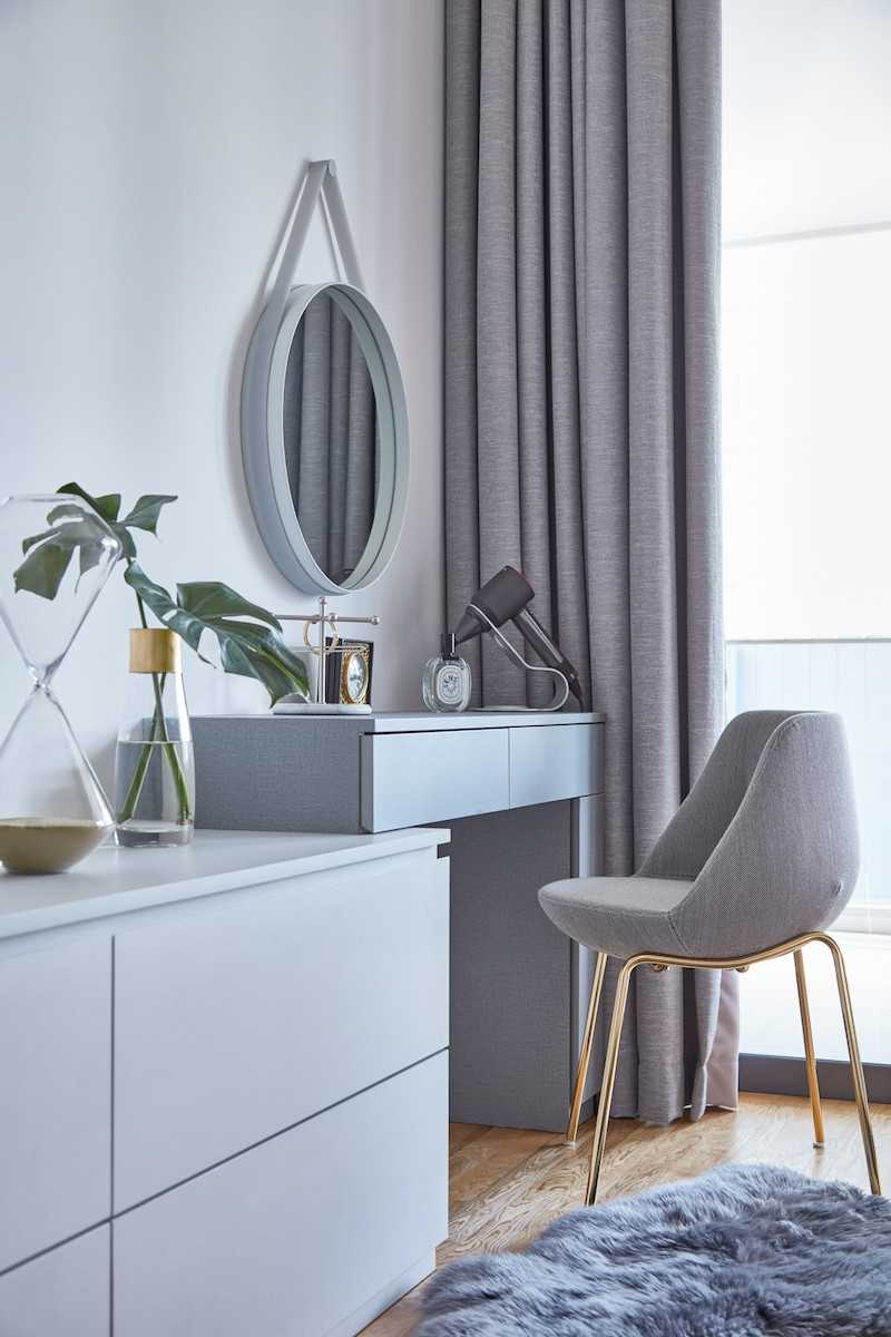 Modern Bedroom with Wood Flooring and Mirror