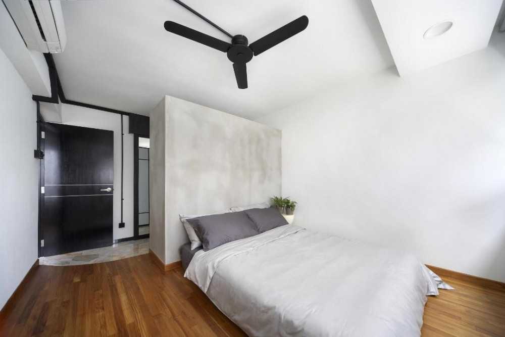 Scandinavian Bedroom with Wood Flooring and Ceiling Light