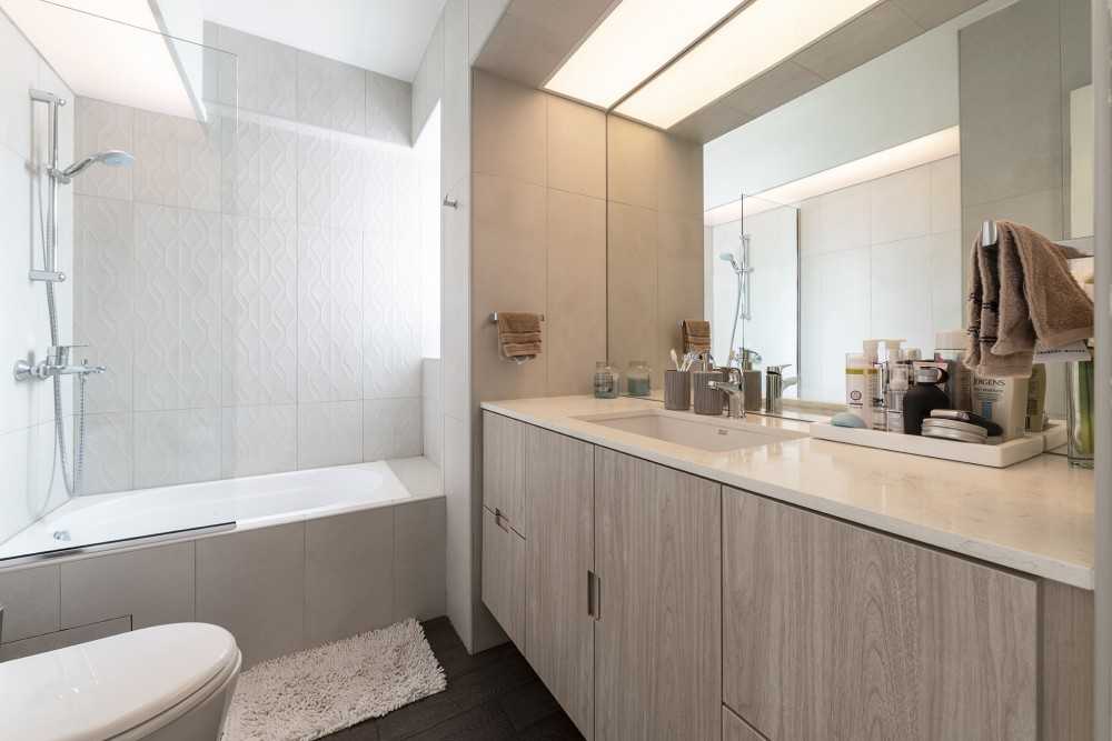 Scandinavian Bathroom with Homogeneous Tiles and Wood Flooring