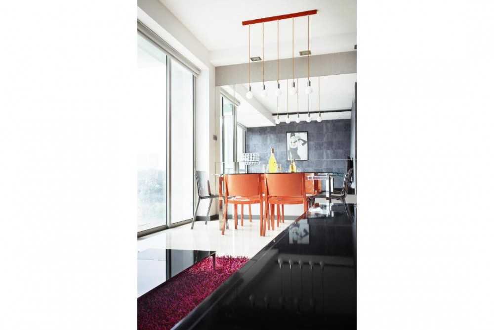 Eclectic Dining Room with Drop Light and Dining Table