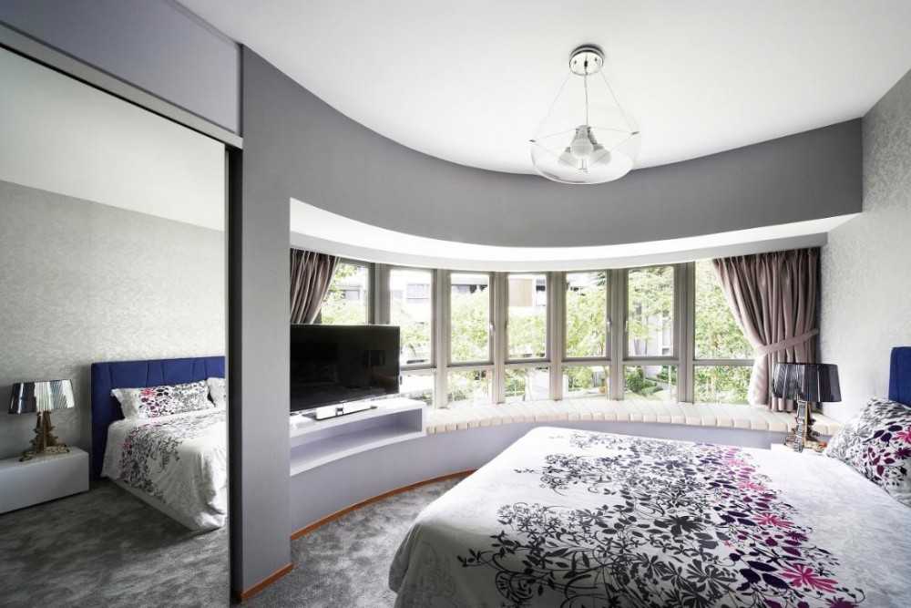 Contemporary Bedroom with Mirror and Bay Window
