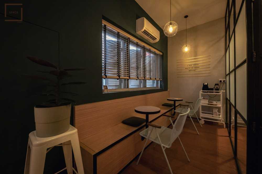 Contemporary Office with Bookshelf and Desk Chairs