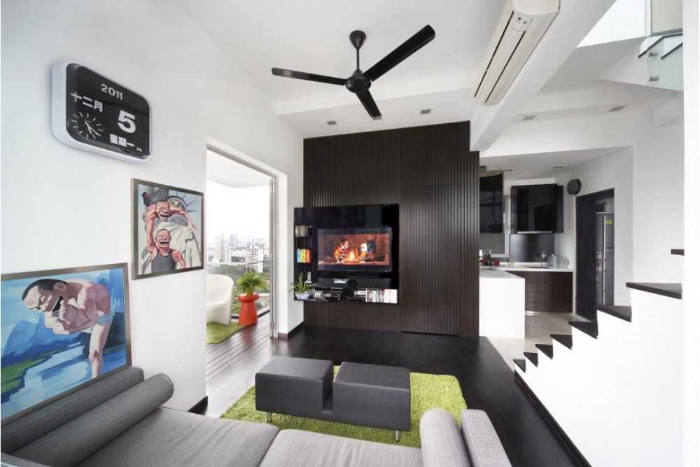 Eclectic Living Room with Staircase and Artwork