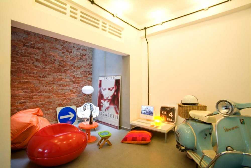 Eclectic Courtyard with Artwork and Side Table
