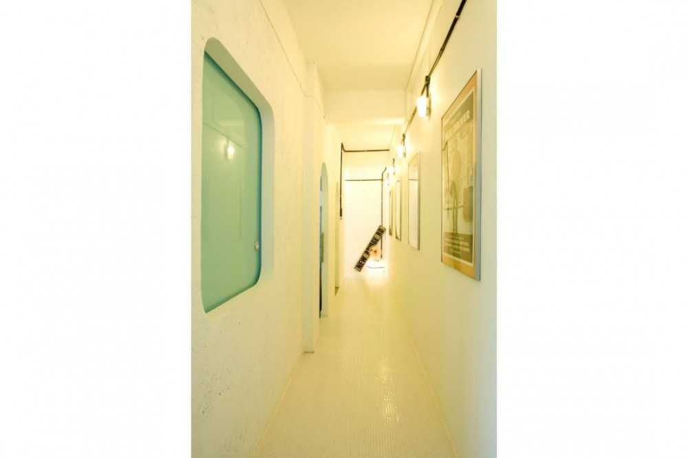 Eclectic Hallway with Artwork and Lighting