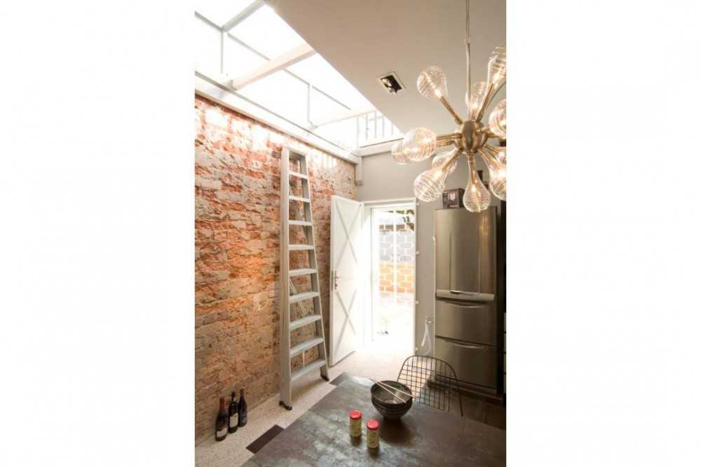 Eclectic Entryway with Chandelier and Dining Table