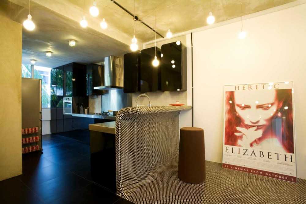 Eclectic Hallway with Artwork and Bar Counter
