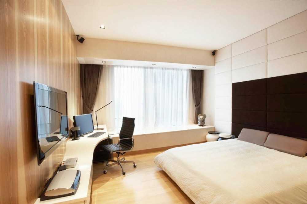 Modern Bedroom with Wood Flooring and Feature Wall
