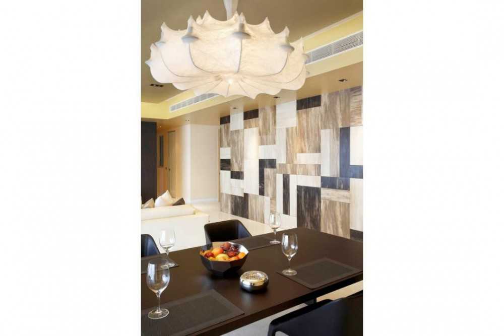 Modern Dining Room with Feature Wall and Chandelier