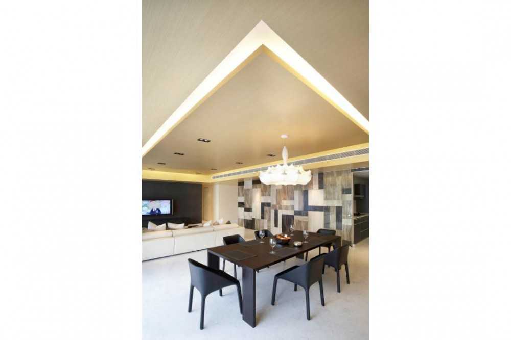 Modern Dining Room with Feature Wall and Cove Lighting