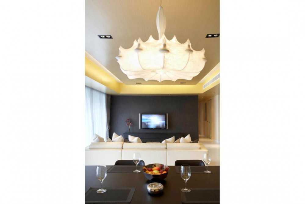 Modern Dining Room with Chandelier and Sofa