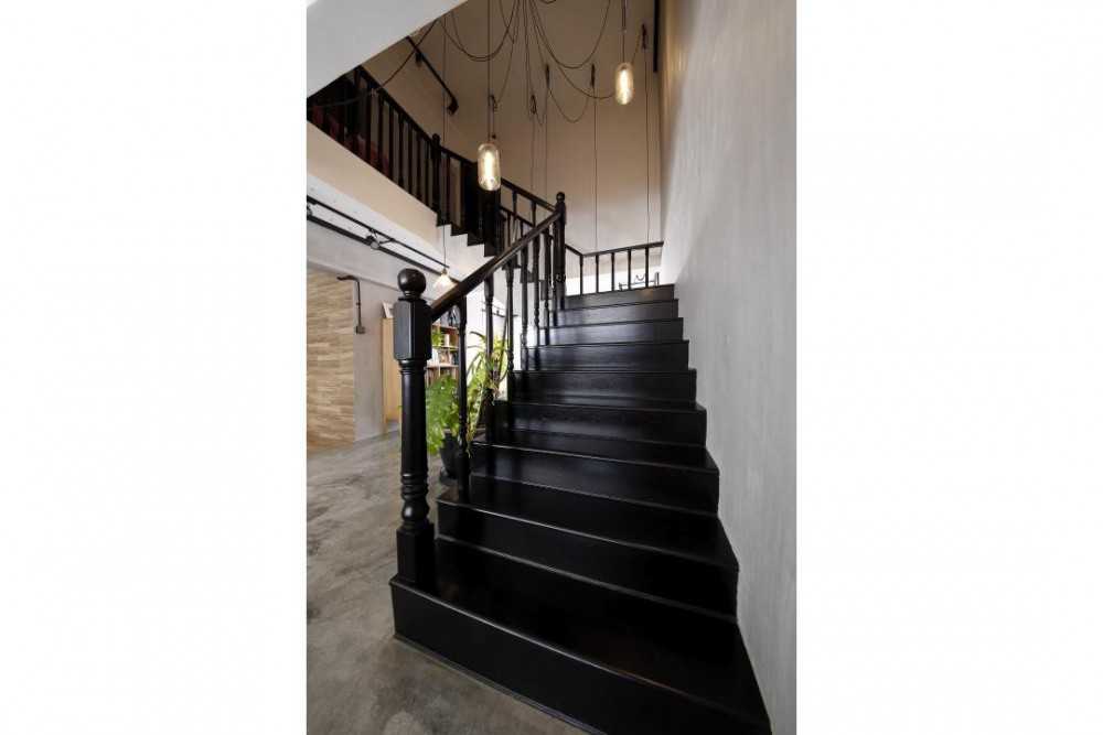 Industrial Hallway with Drop Light and Staircase