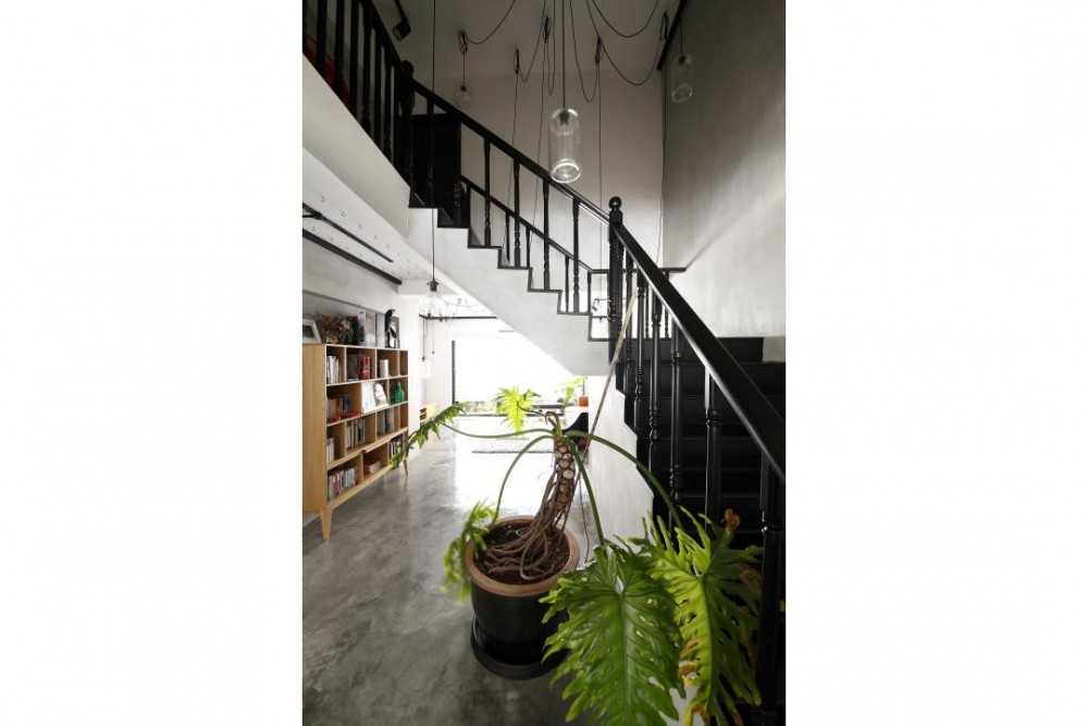 Industrial Hallway with Cement Floor and Staircase