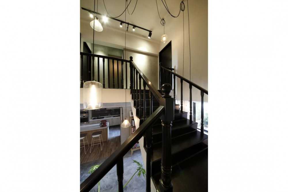 Industrial Hallway with Drop Light and Staircase