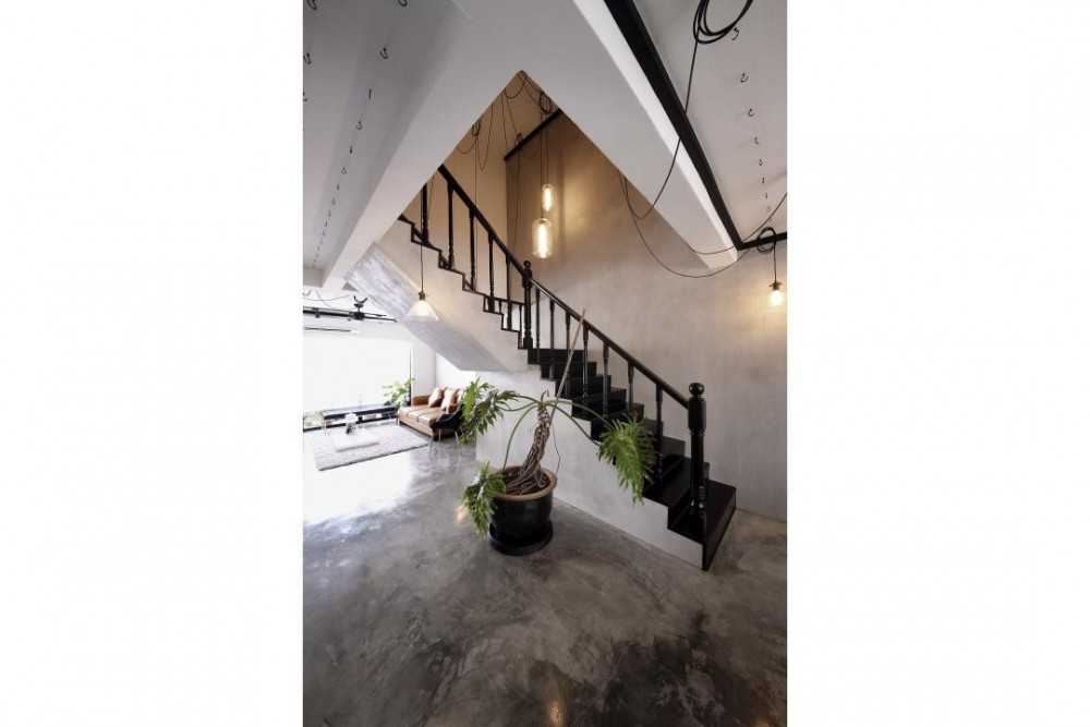 Industrial Hallway with Cement Floor and Staircase