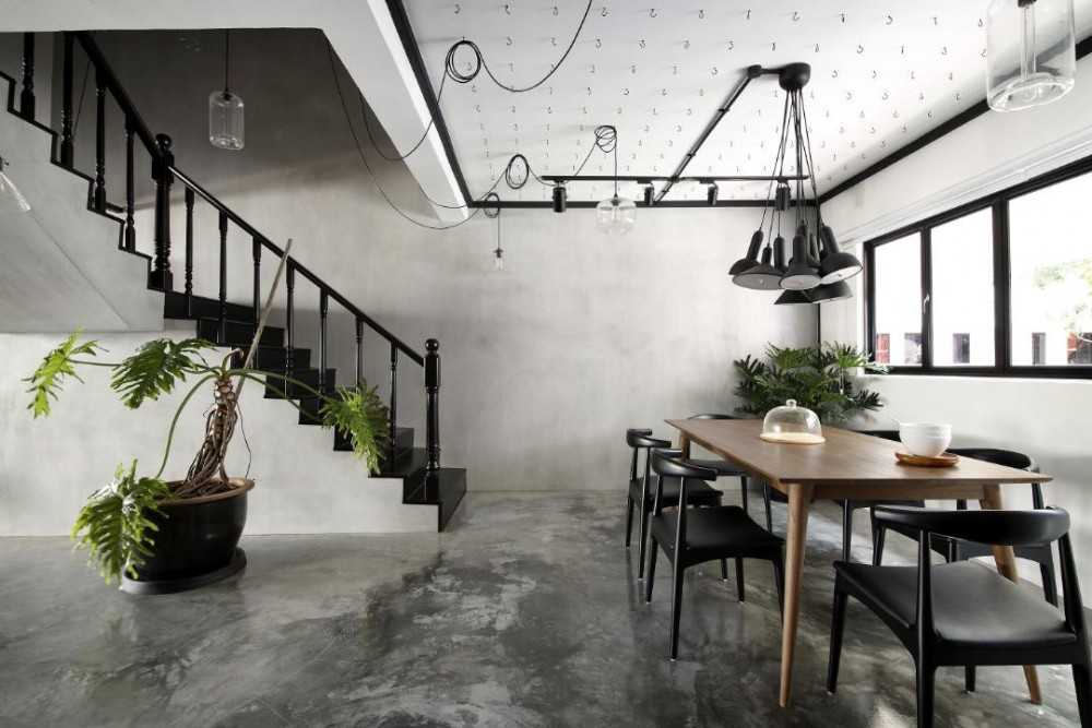 Industrial Dining Room with Cement Floor and Drop Light