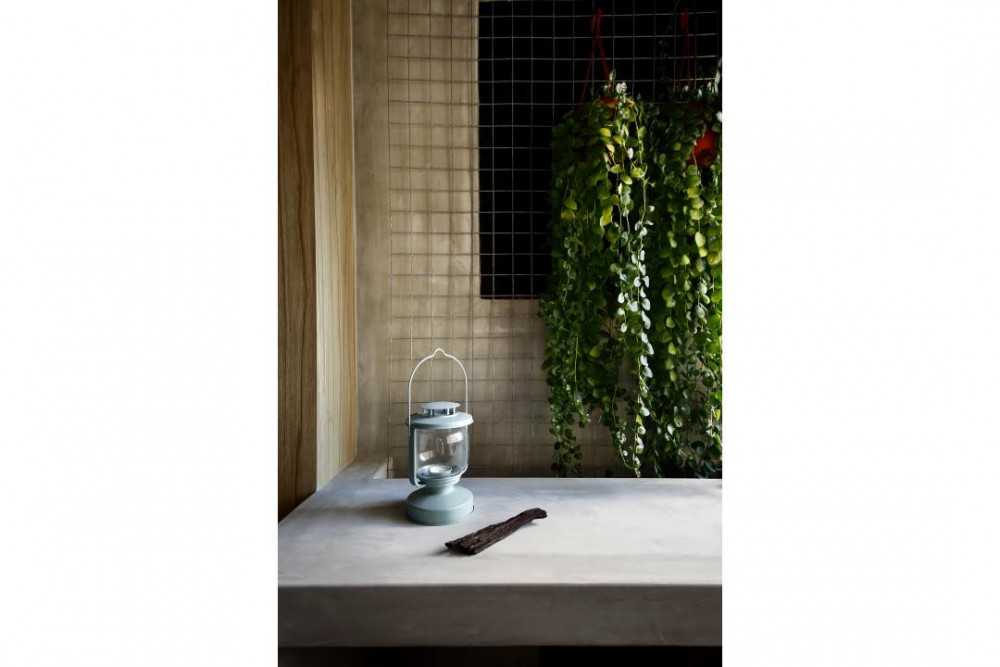 Industrial Entryway with Bar Counter and Houseplants