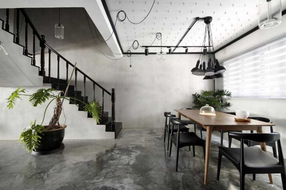 Industrial Dining Room with Cement Floor and Drop Light