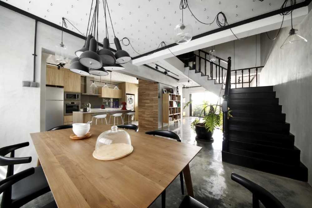 Industrial Dining Room with Drop Light and Staircase