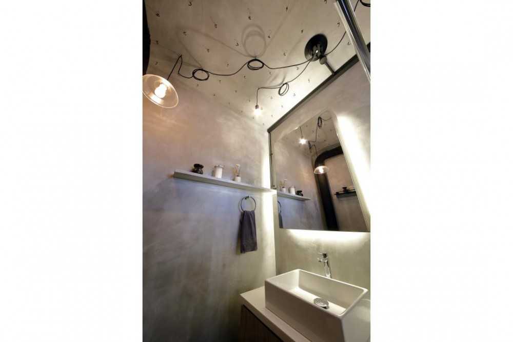 Industrial Bathroom with Drop Light and Mirror