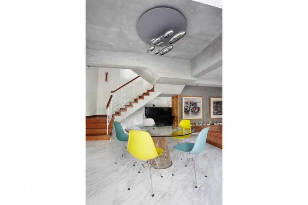 Eclectic Dining Room with Marble Floor and Staircase