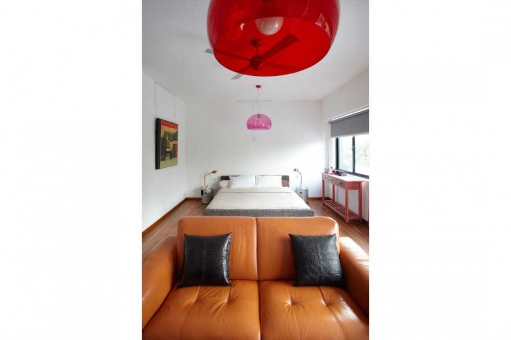 Eclectic Bedroom with Drop Light and Ceiling Light