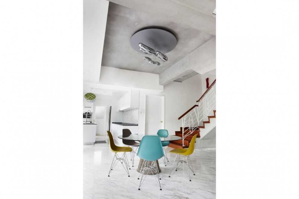 Eclectic Dining Room with Marble Floor and Staircase