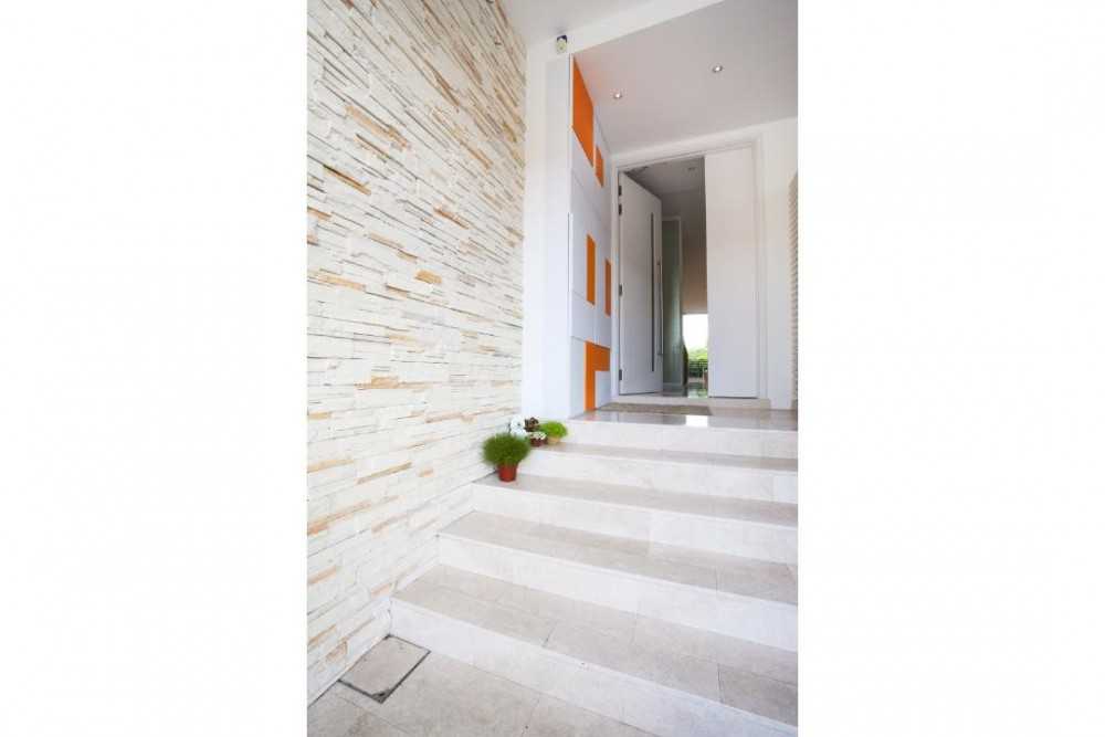 Vintage Foyer with Feature Wall and Staircase