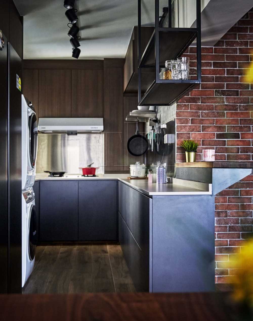 Industrial Kitchen with Wood Flooring and Feature Wall
