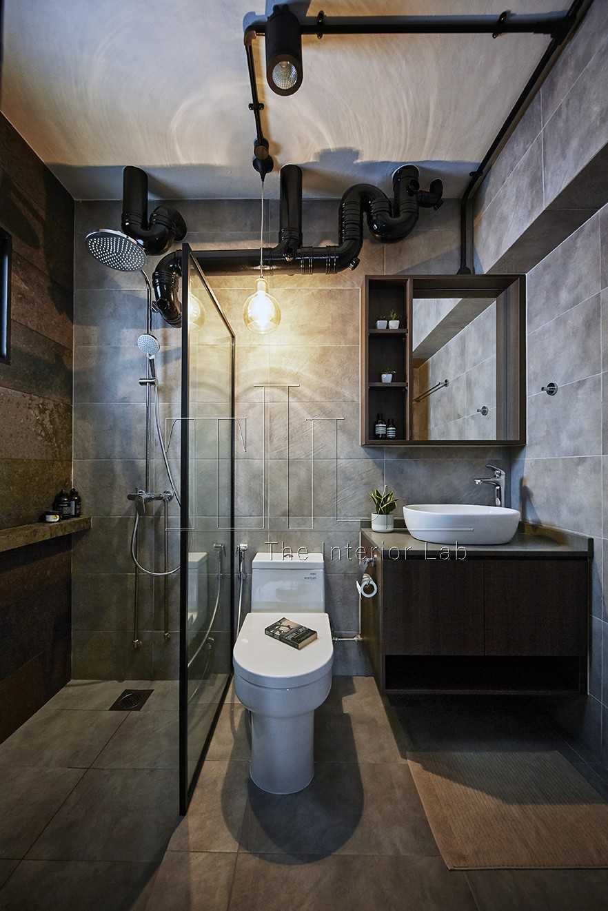Industrial Bathroom with Cement Floor and Mirror