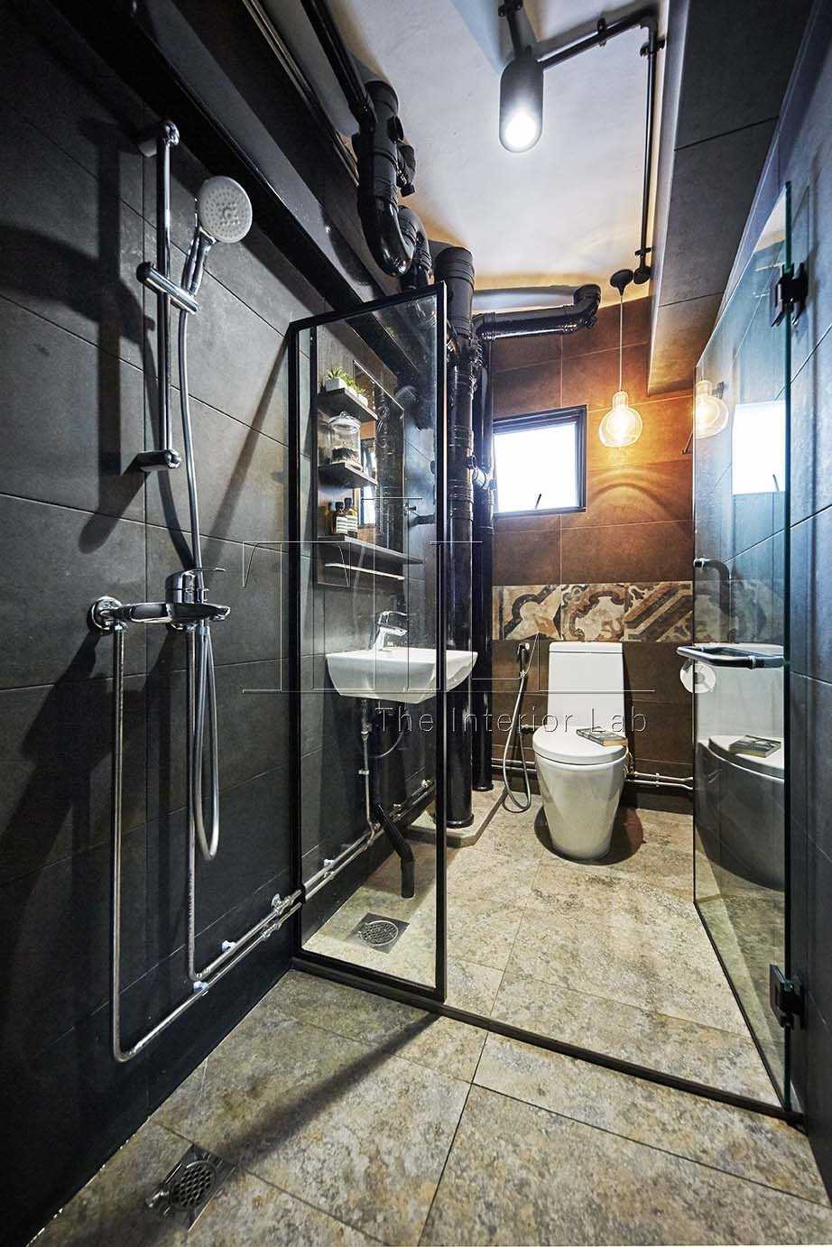 Industrial Bathroom with Homogeneous Tiles and Mirror