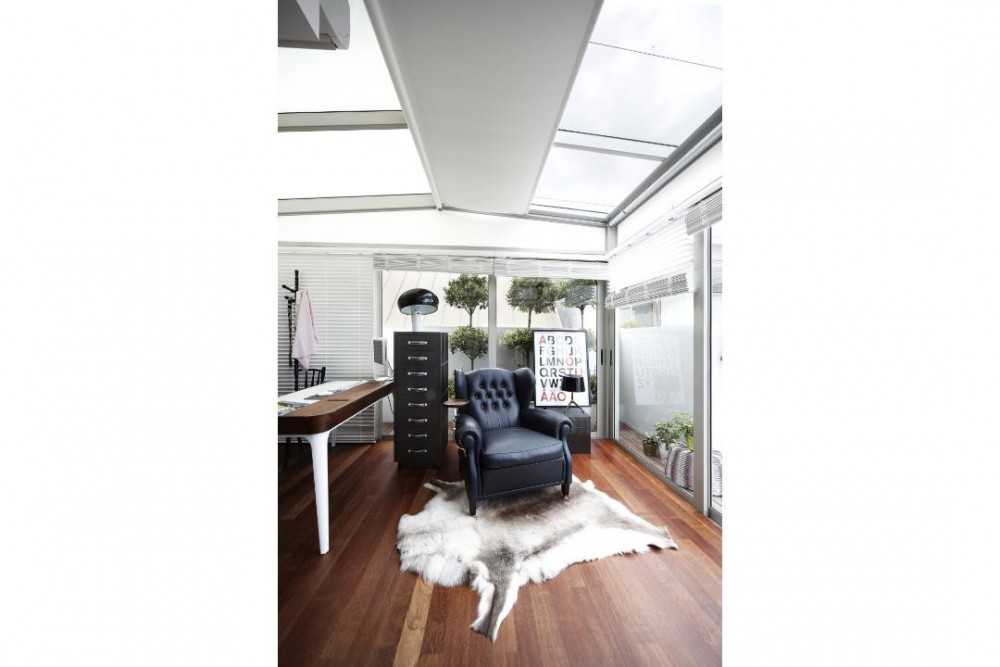 Eclectic Study with Wood Flooring and Armchairs