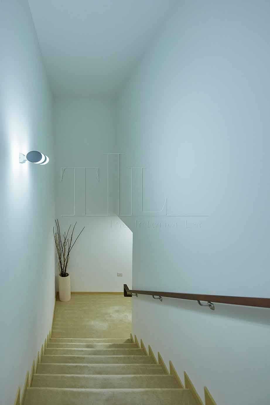 Minimalist Hallway with Staircase and Flooring