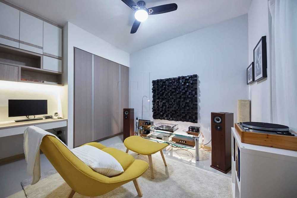 Minimalist Home Office with Artwork and Ceiling Fan