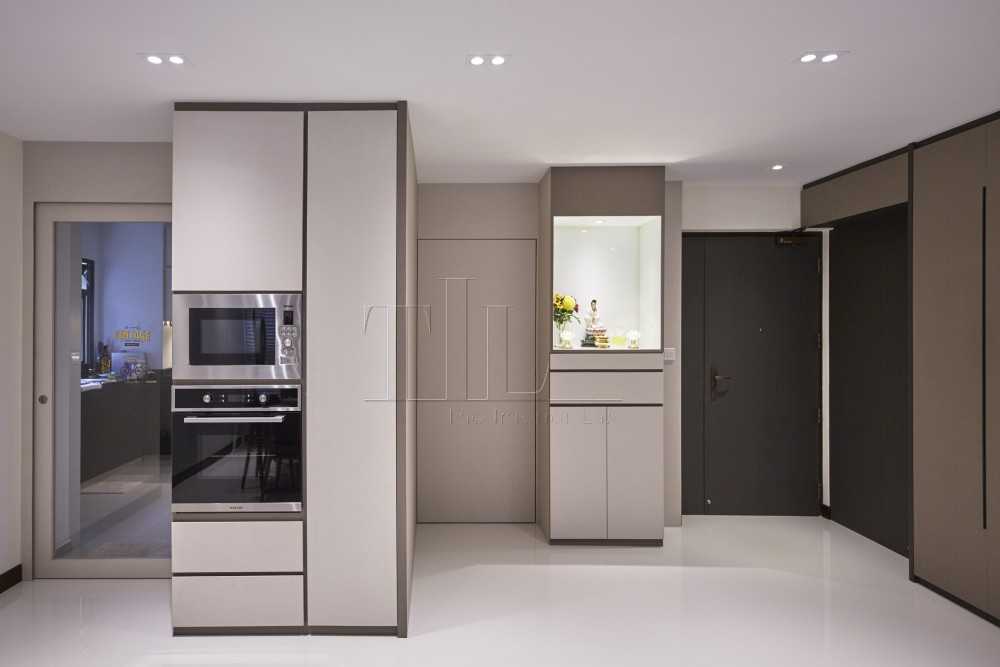 Contemporary Hallway with Artwork and Storage Cabinets