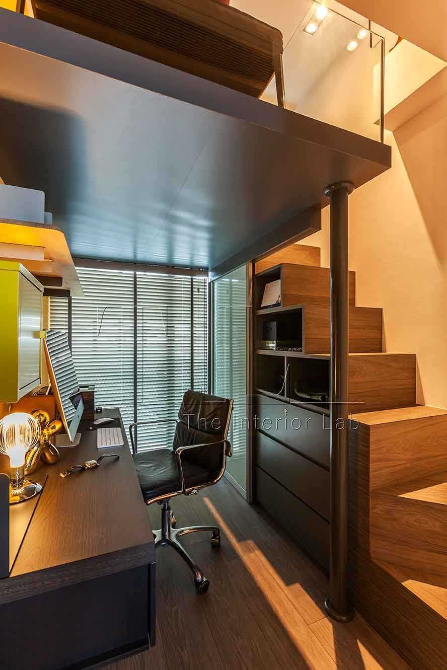 Industrial Home Office with Staircase and Desk Chairs