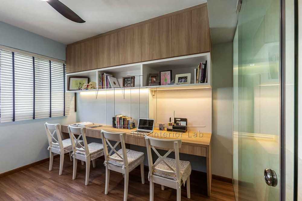 Contemporary Home Office with Cove Lighting and Desk Chairs