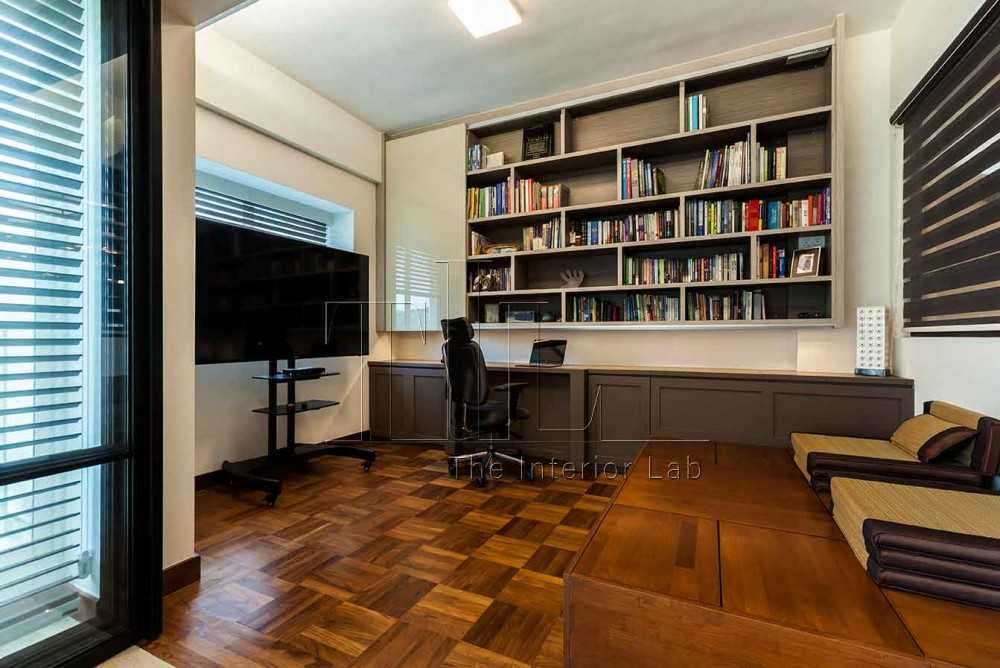 Eclectic Home Office with Bookshelf and TV