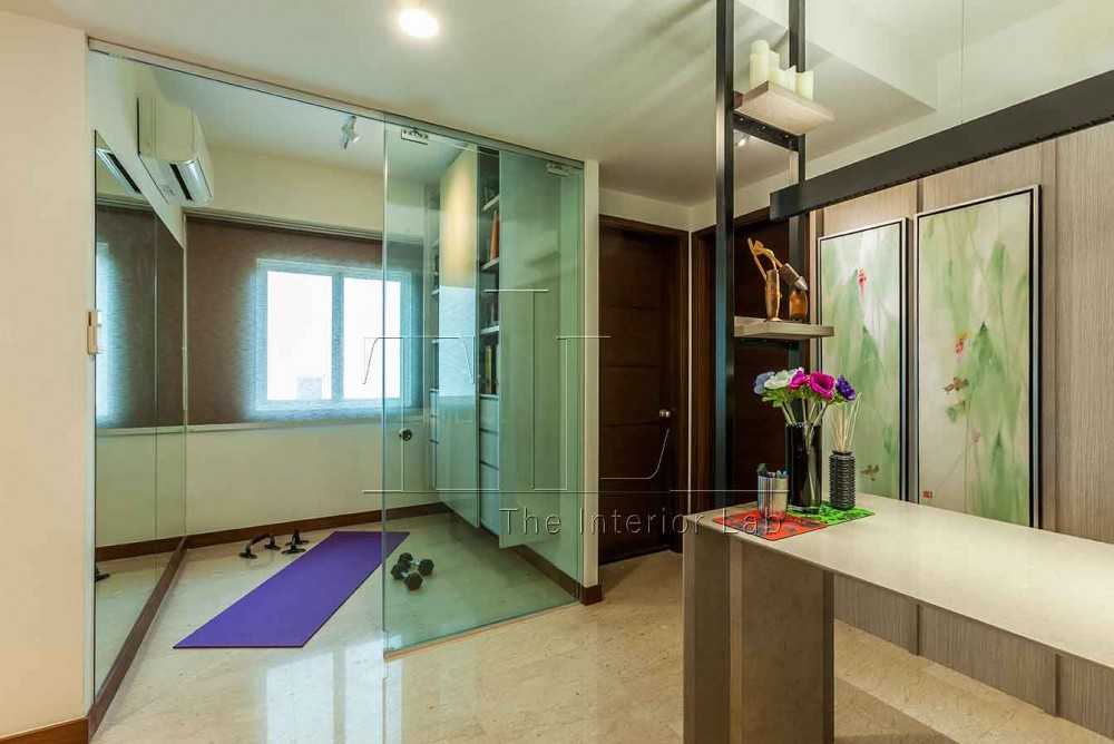 Eclectic Home Gym with Bookshelf and Bay Window
