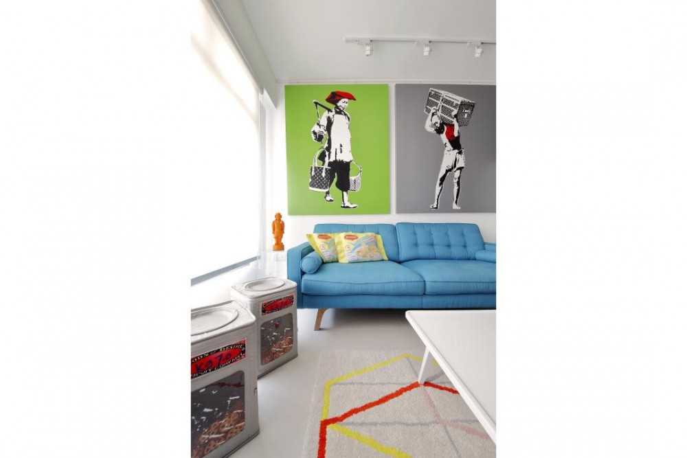 Transitional Living Room with Sofa and Paintings