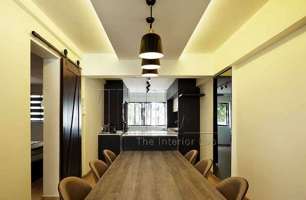 Industrial Dining Room with Cove Lighting and Open Kitchen