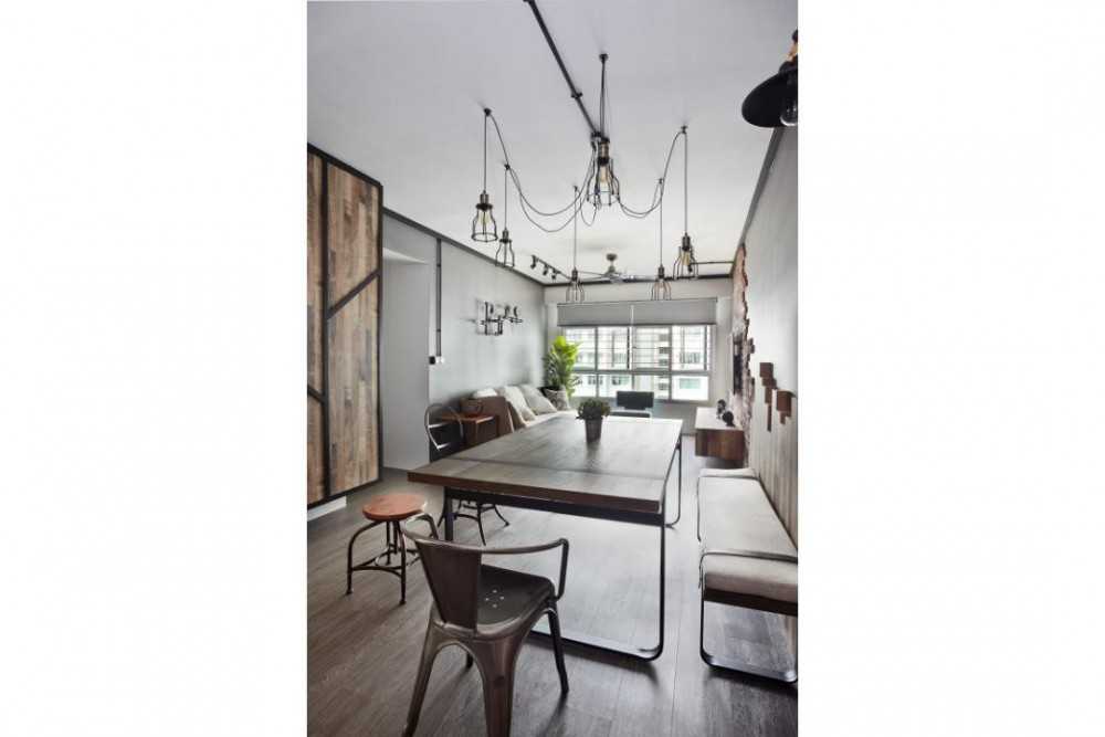 Industrial Dining Room with Drop Light and Dining Table