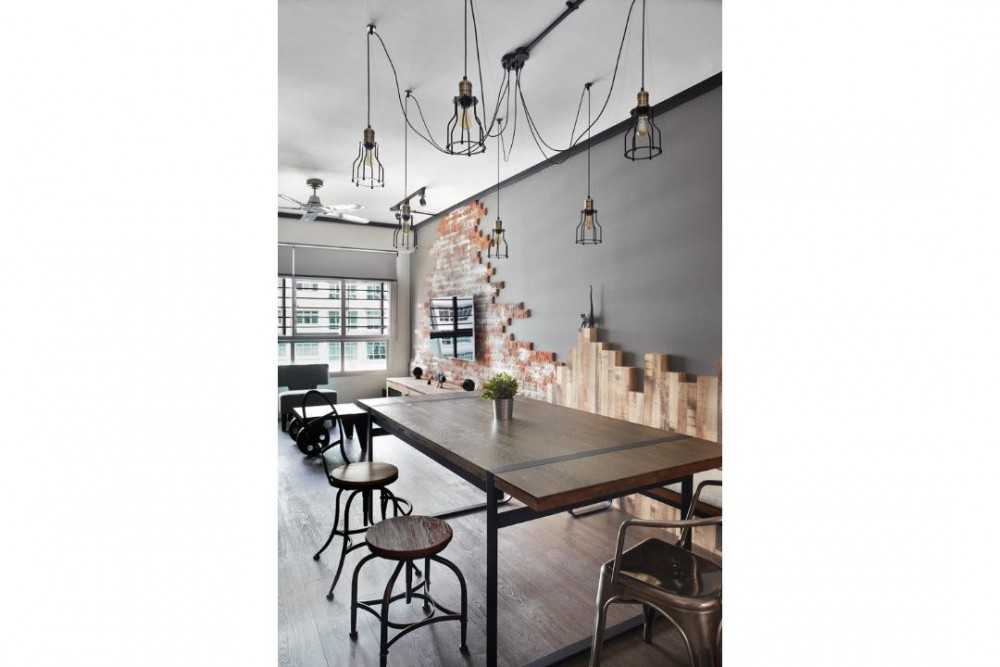 Industrial Dining Room with Drop Light and Dining Table
